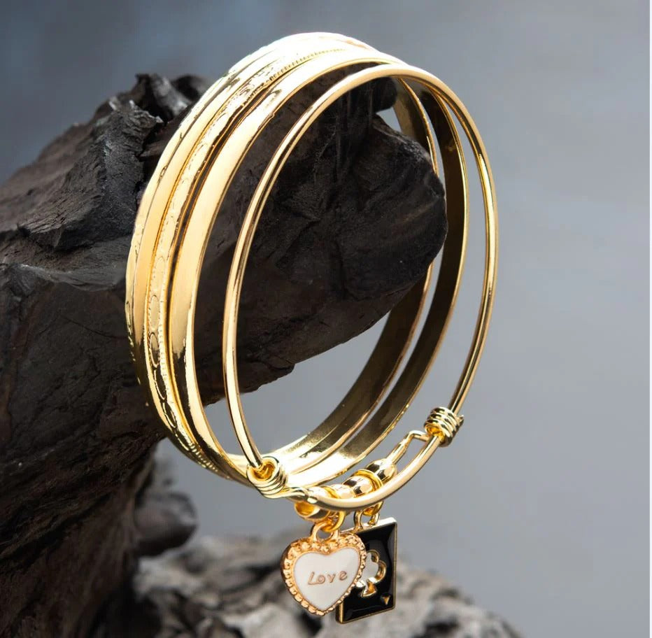 Gold plated beaded designer set of bangles with love charms